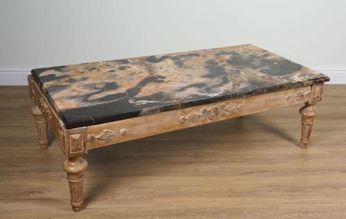 A MARBLE RECTANGULAR COFFEE TABLE ON A CARVED AND POLYCHROME PAINTED BASE