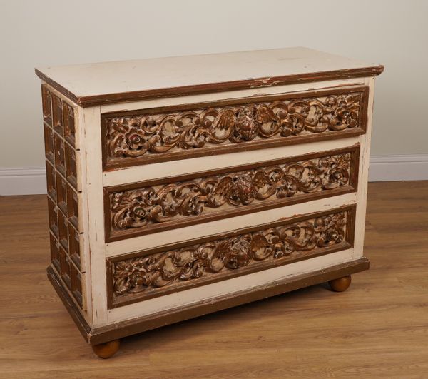 A PARCEL-GILT CREAM PAINTED THREE DRAWER CHEST