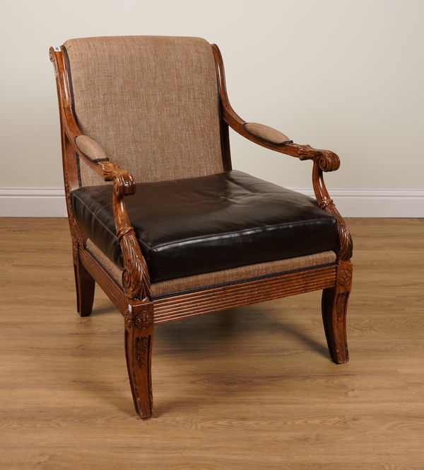 A REGENCY STYLE FAUX GRAINED SABRE LEG OPEN ARMCHAIR