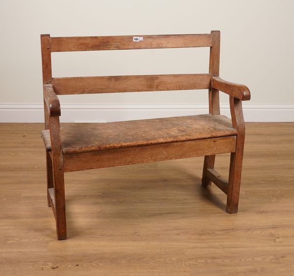 A SMALL 19TH CENTURY PINE SLAT BACK BENCH