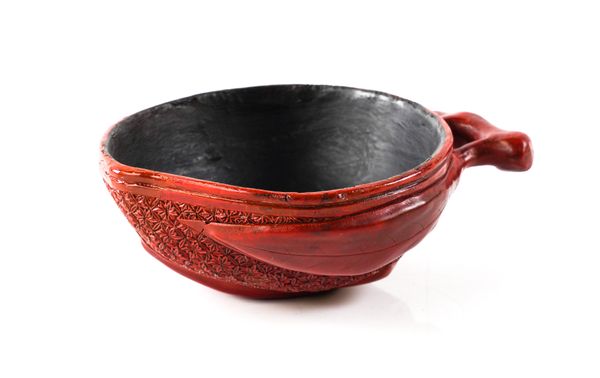 A CHINESE CINNABAR LACQUER LIBATION CUP