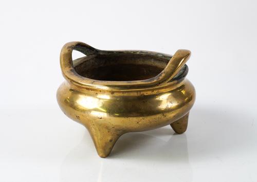 A CHINESE BRONZE TRIPOD CENSER