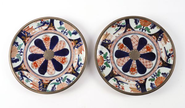 A PAIR OF JAPANESE IMARI PLATES WITH LATER SILVER MOUNTS (2)