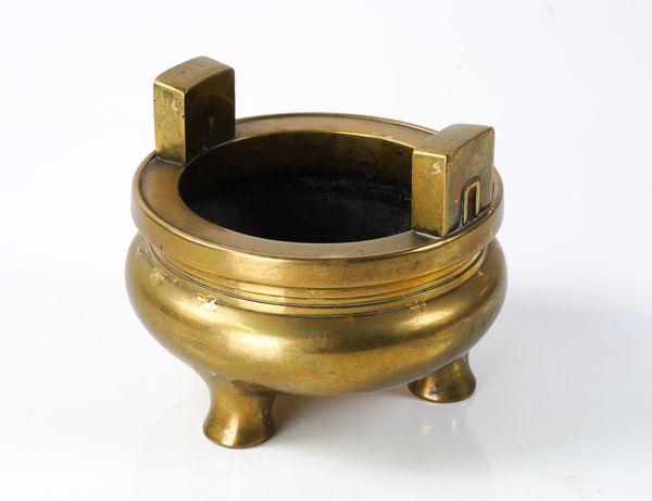 A CHINESE BRONZE TRIPOD CENSER