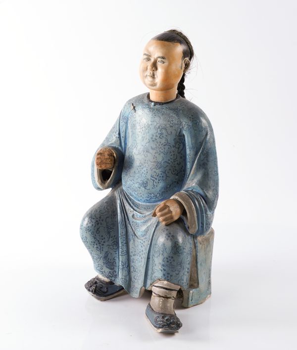 A RARE CHINESE EXPORT PAINTED CLAY FIGURE