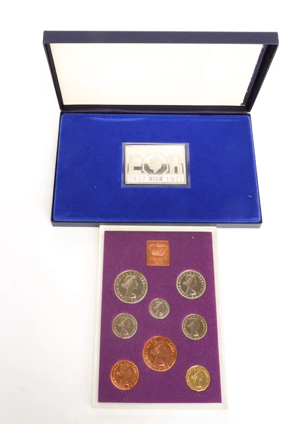 THREE PROOF COIN SETS AND A SILVER POSTAGE STAMP INGOT (4)