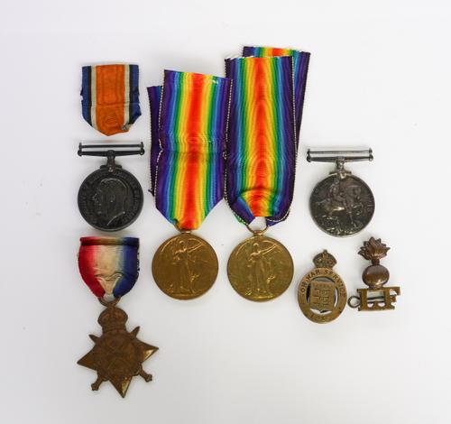 A GROUP OF THREE FIRST WORLD WAR MEDALS, TWO FURTHER MEDALS AND TWO BADGES  (7)