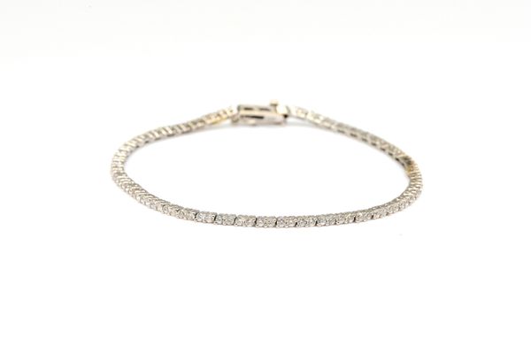 A WHITE GOLD AND DIAMOND SET LINE BRACELET