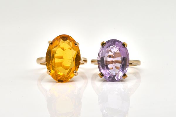 A 9CT GOLD AND AMETHYST SINGLE STONE RING AND ANOTHER RING (2)