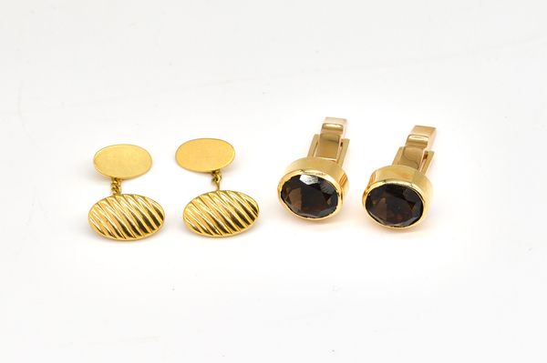 A PAIR OF GOLD AND SMOKY QUARTZ CUFFLINKS AND ANOTHER PAIR OF CUFFLINKS (2)