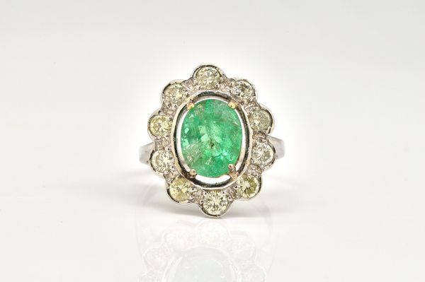 A RUSSIAN WHITE GOLD, EMERALD AND DIAMOND CLUSTER RING