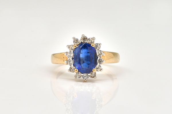 A 9CT GOLD SAPPHIRE CLUSTER RING