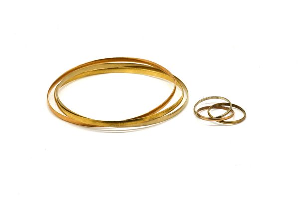 A THREE COLOUR GOLD BANGLE AND A SIMILAR RING (2)