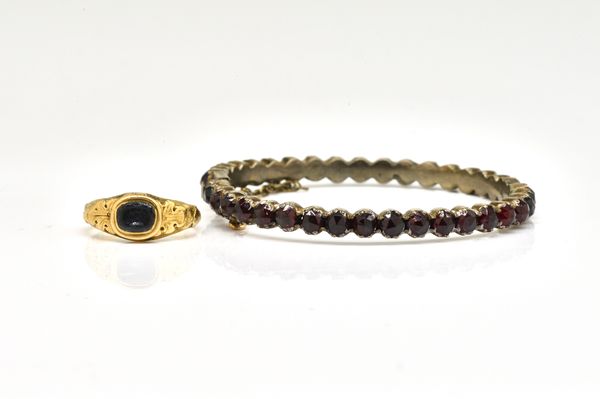 A GOLD RING AND A GARNET BRACELET (2)