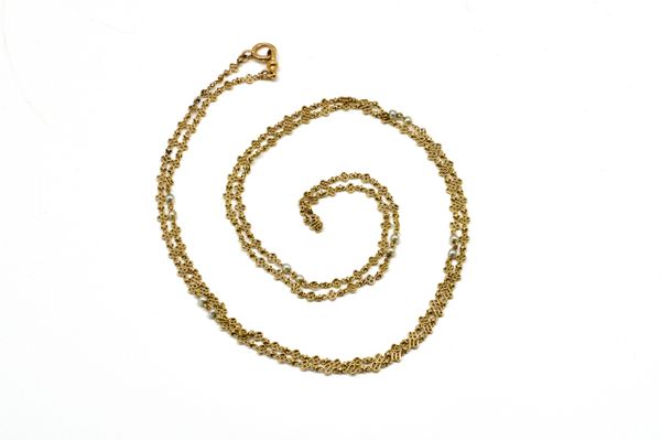 A GOLD GUARD CHAIN SET WITH PEARLS