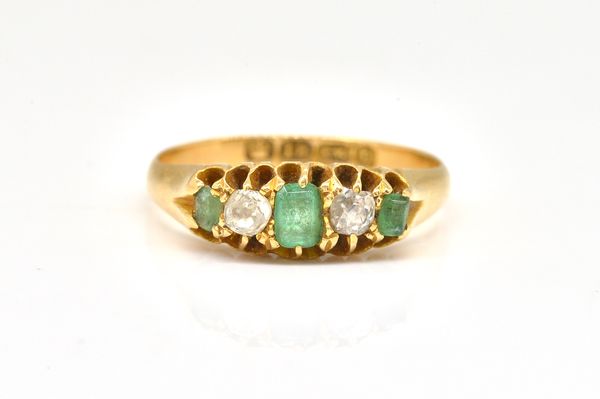 AN 18CT GOLD VICTORIAN EMERALD AND DIAMOND FIVE STONE RING