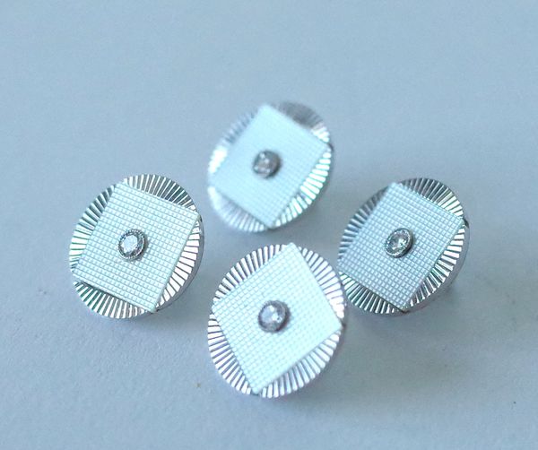 A SET OF FOUR WHITE GOLD, DIAMOND AND MOTHER-OF-PEARL DRESS BUTTONS (4)