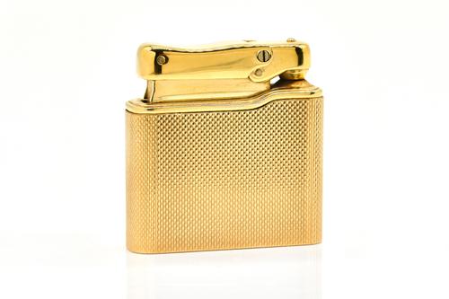 A 9CT GOLD CASED COLIBRI LIGHTER