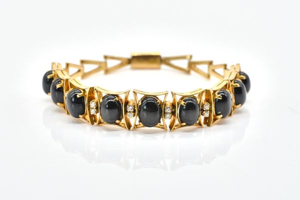 WITHDRAWN A GOLD, BLACK SAPPHIRE AND DIAMOND BRACELET