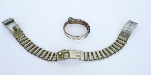 A SMALL ENGLISH SILVER-PLATED DOG COLLAR (2)