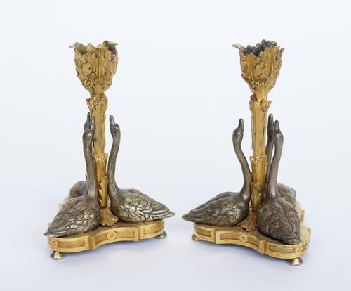 A PAIR OF GILT-BRONZE SWAN CANDLESTICKS (2)