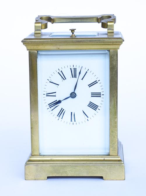 A BRASS REPEATING CARRIAGE CLOCK