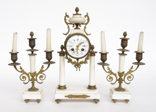 A FRENCH LOUIS XVI STYLE GILT-METAL MOUNTED WHITE MARBLE CLOCK GARNITURE (3)