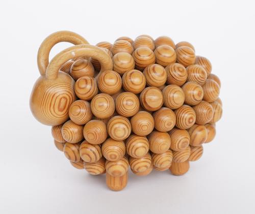 AARIKKA, FINLAND: ‘PASSI’ VARNISHED WOODEN SCULPUTURE OF A RAM