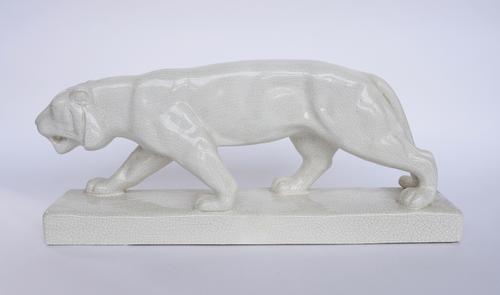 EMAUX DE LOWIEDE: A CERAMIC SCULPTURE OF A STALKING LEOPARD