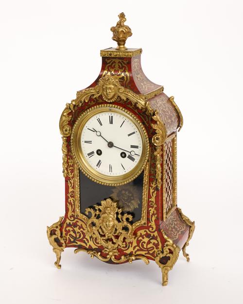 A FRENCH GILT-METAL RED TORTOISESHELL AND BRASS MARQUETRY ‘BOULLE’ MANTEL CLOCK