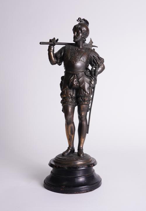 A FRENCH GILT AND PATINATED SPELTER MODEL OF A RENAISSANCE SOLDIER WITH HALBERD