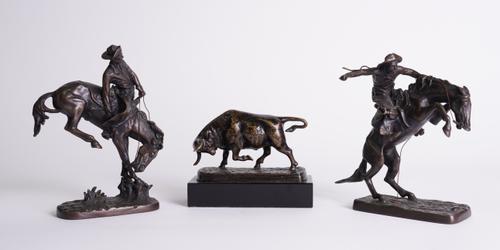 AFTER FREDERIC REMINGTON (1861-1909): A BRONZE EQUESTRIAN REDUCTION OF THE BRONCO BUSTER AND ANOTHER (3)