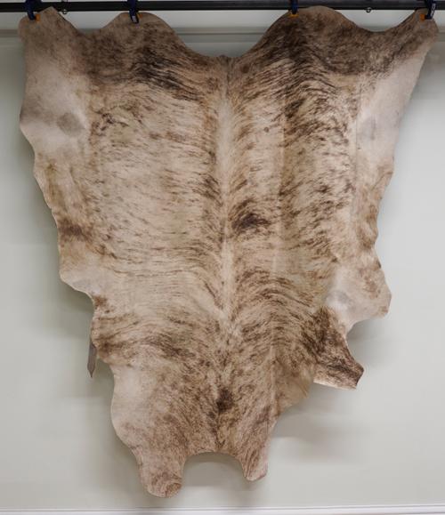 TWO COW HIDE FLOOR RUGS (2)