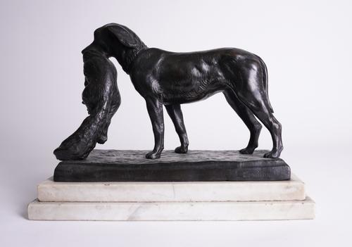 AN EAST EUROPEAN PATINATED BRONZE OF A RETRIEVER