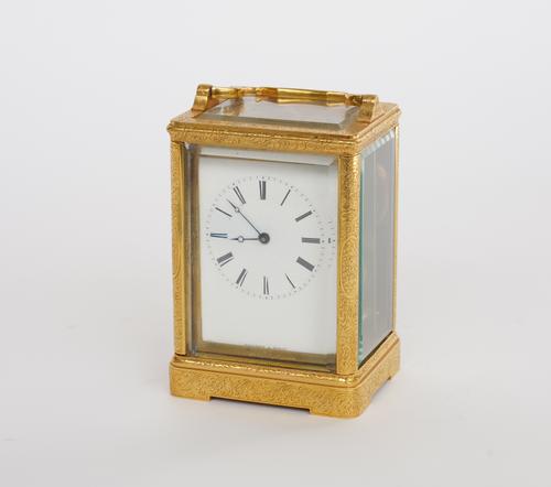 MARCHAND A GENEVE: A SWISS GILT BRASS CARRIAGE CLOCK