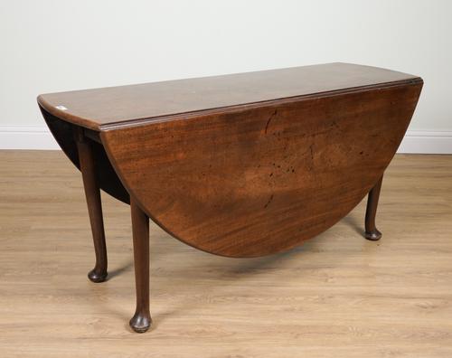 A GEORGE II OVAL MAHOGANY PAD FOOT DROP-FLAP TABLE