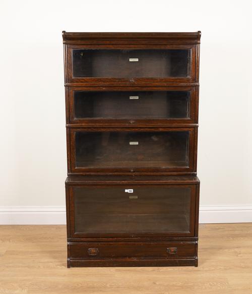 GLOBE WERNICKE; A STAINED OAK FOUR SECTION BOOKCASE