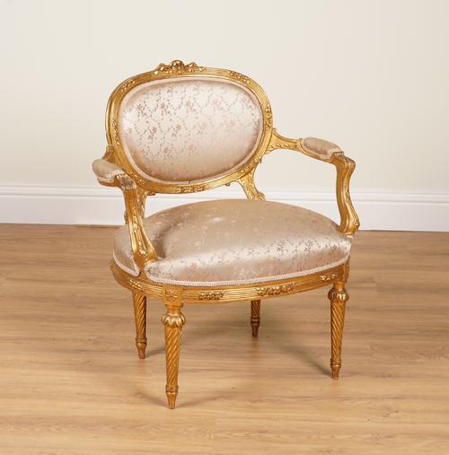 A FRENCH LOUIS XVI STYLE GILT FRAMED ARMCHAIR WITH OVAL SHAPED BACK