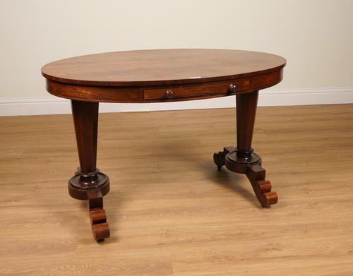A GEORGE IV ROSEWOOD OVAL CENTRE TABLE