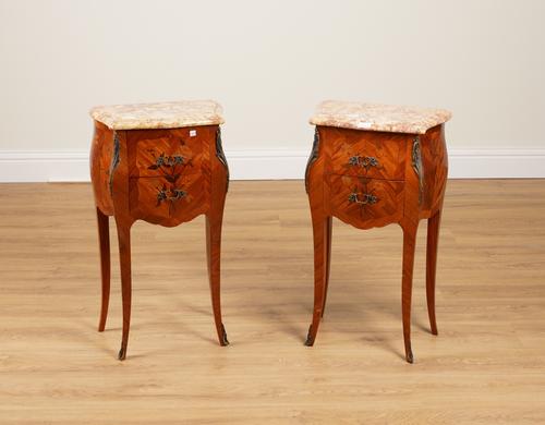A PAIR OF FRENCH MARBLE-TOPPED GILT METAL MOUNTED MARQUETRY INLAID BOMBE SHAPED TWO DRAWER BEDSIDE TABLES (2)