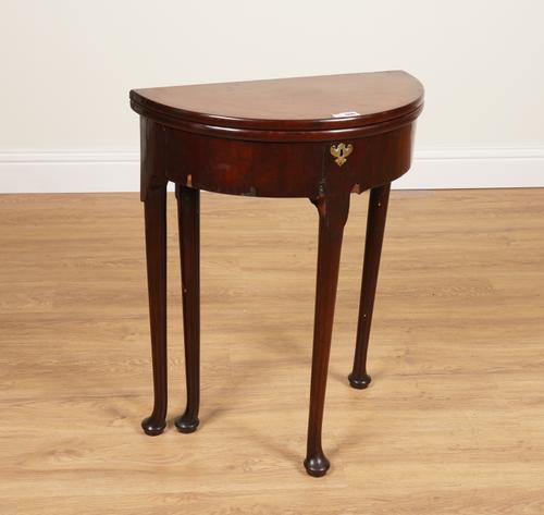 A GEORGE II MAHOGANY DEMI-LUNE FOLD OVER TEA TABLE OF SMALL PROPORTIONS
