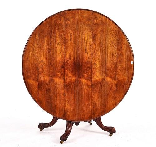 AN EARLY VICTORIAN ROSEWOOD CIRCULAR SNAP-TOP BREAKFAST TABLE