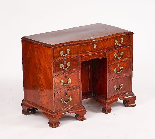 A GEORGE III INLAID MAHOGANY SERPENTINE KNEEHOLE COMBINATION WRITING DESK