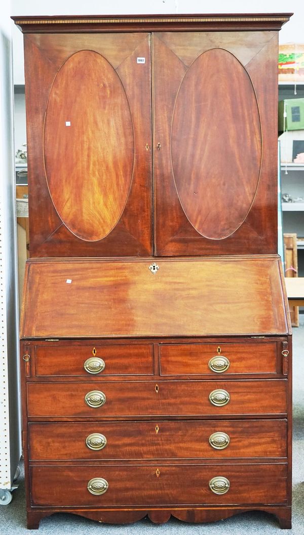 A GEORGE III MAHOGANY BUREAU BOOKCASE