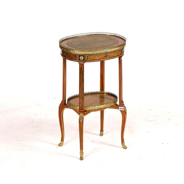 A LOUIS XVI STYLE GILT-METAL MOUNTED MARQUETRY INLAID OVAL TWO TIER OCCASIONAL TABLE