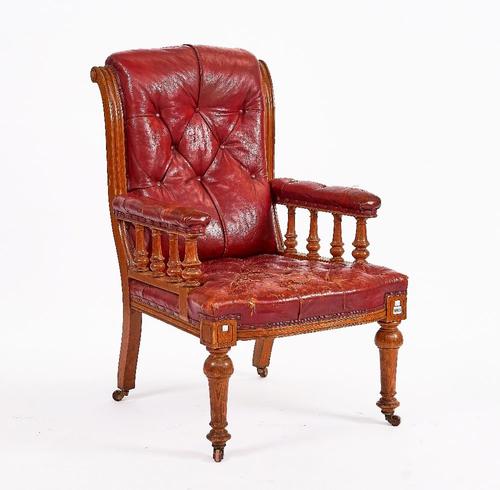 A VICTORIAN OAK OPEN ARMCHAIR