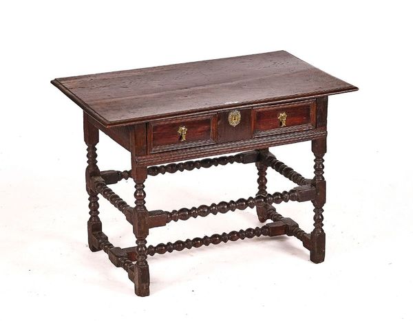 A CHARLES II OAK SINGLE DRAWER SIDE TABLE