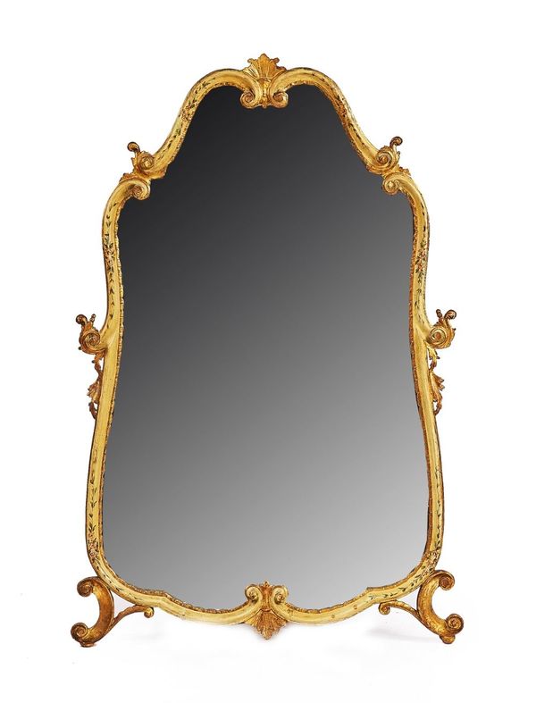 AN ITALIAN ROCOCO REVIVAL PARCEL-GILT CREAM PAINTED SHAPED WALL MIRROR