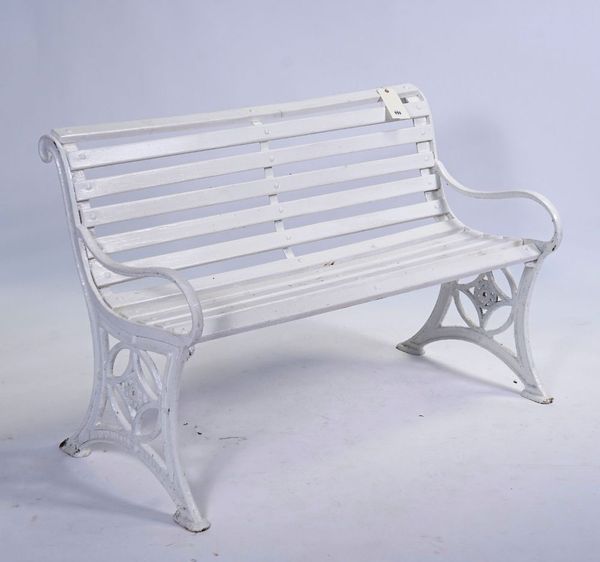 A 19TH CENTURY WHITE PAINTED CAST IRON GARDEN BENCH