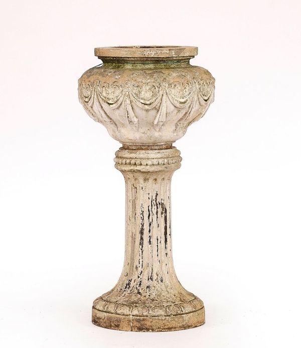 A LATE 19TH/EARLY 20TH CENTURY WHITE PAINTED STONEWARE URN